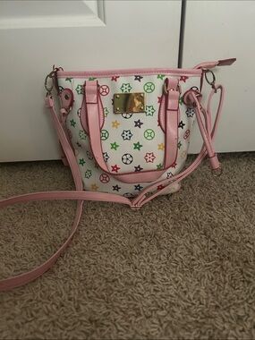 A Classy Chic Boutique White Mini Satchel with Pink Trim and Multicolor Stars